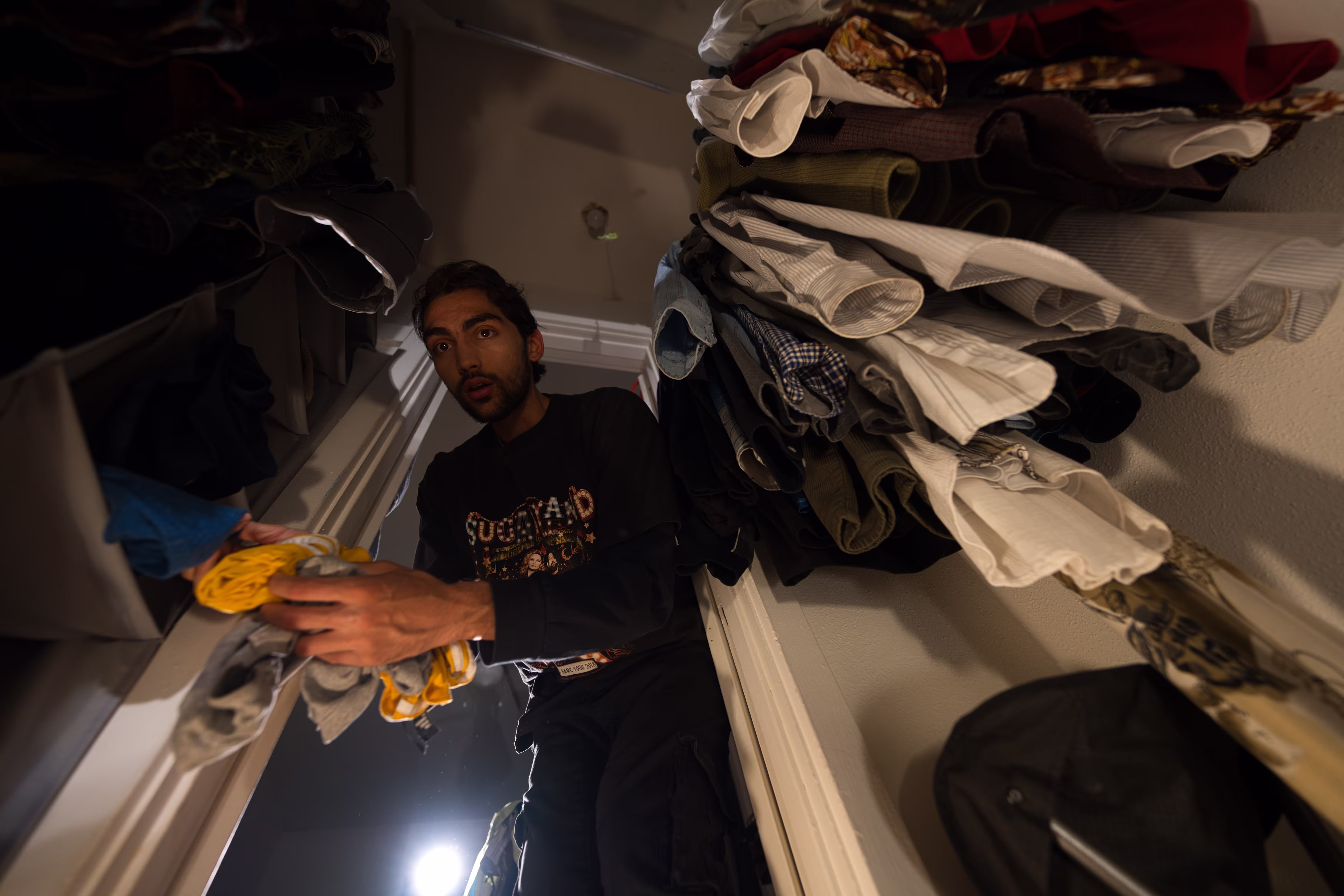 Sorting laundry in the closet