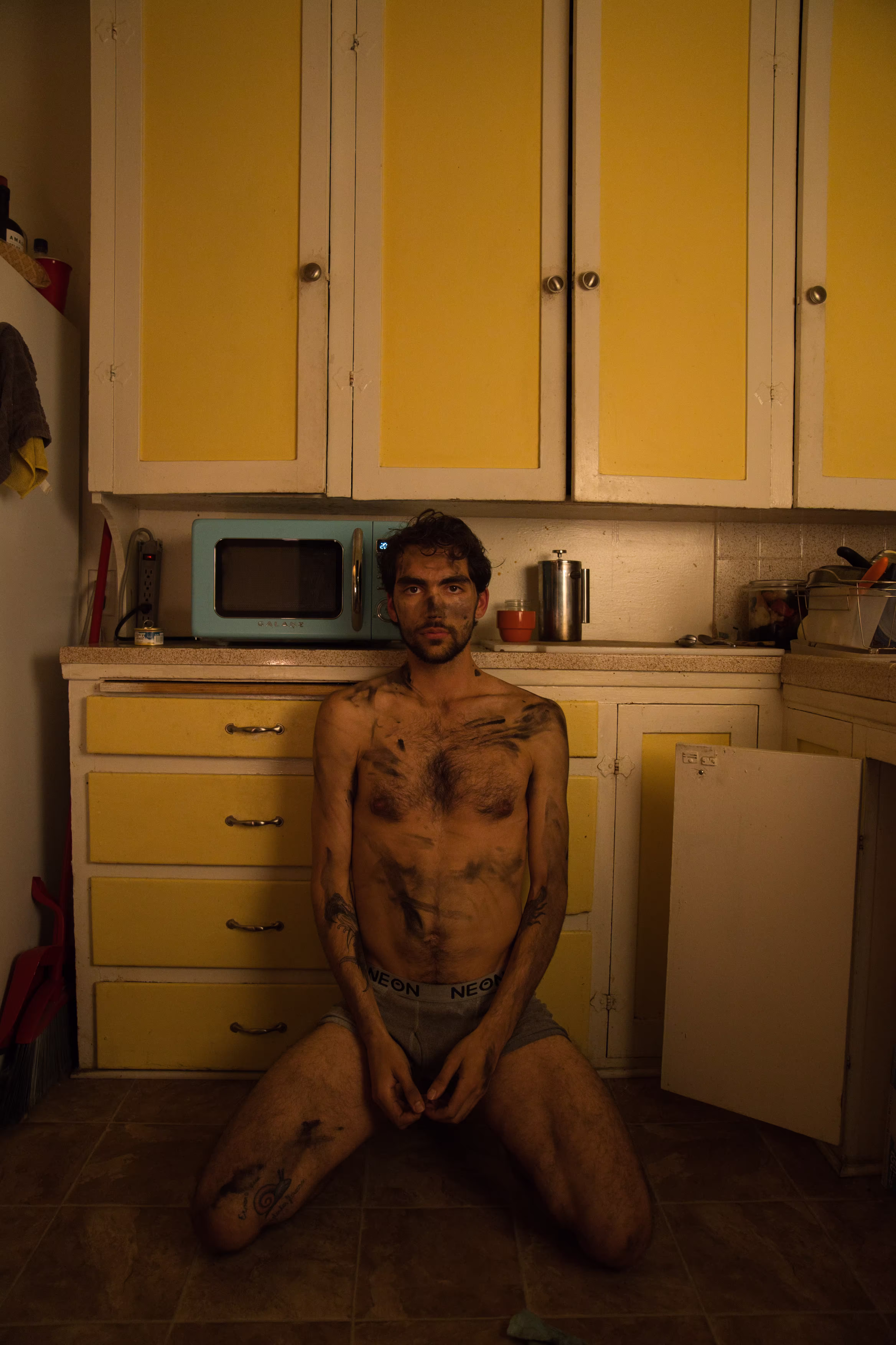 General portrait against the backdrop of the kitchen cabinets